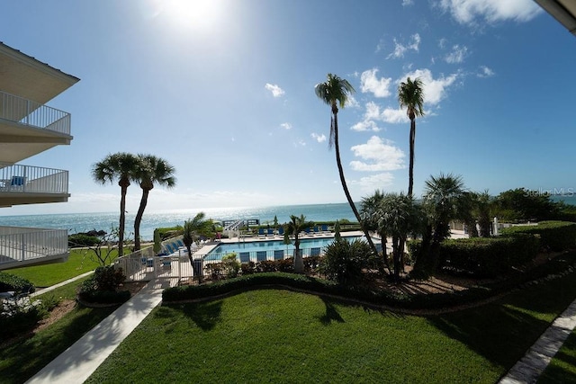 exterior space with a lawn and a water view