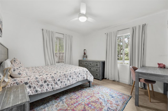 bedroom with ceiling fan and light wood-type flooring