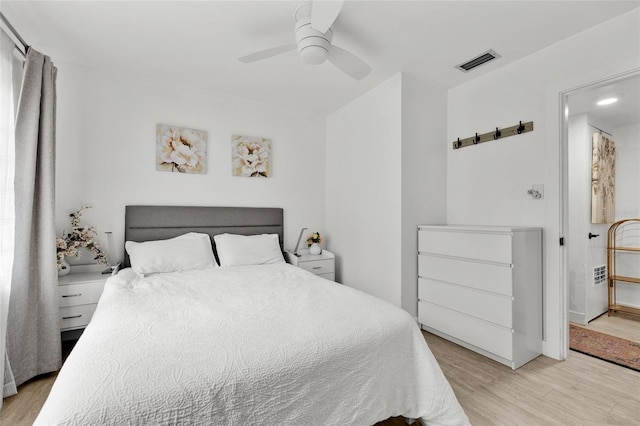 bedroom featuring ceiling fan and light hardwood / wood-style flooring