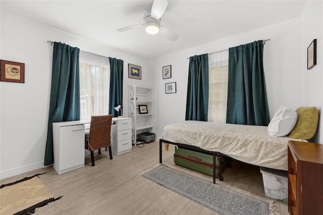 bedroom featuring light hardwood / wood-style flooring and ceiling fan