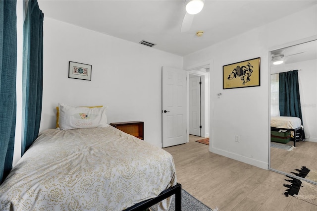 bedroom with ceiling fan and light hardwood / wood-style floors