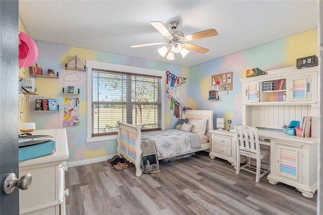 bedroom featuring ceiling fan and wood-type flooring