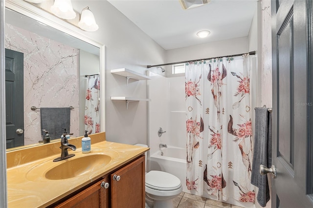 full bathroom featuring shower / bath combo with shower curtain, tile patterned floors, vanity, and toilet