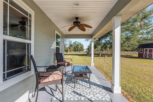 view of patio / terrace with a storage shed, an outdoor hangout area, and ceiling fan