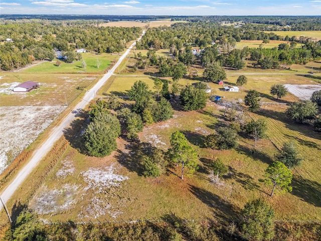 birds eye view of property featuring a rural view