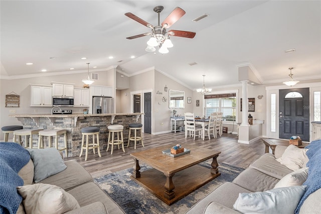 living room featuring crown molding, dark hardwood / wood-style flooring, and lofted ceiling