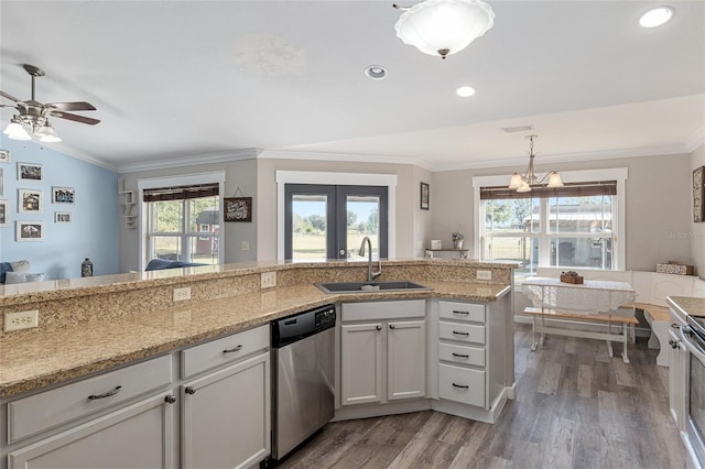 kitchen featuring sink, wood-type flooring, white cabinetry, and dishwasher