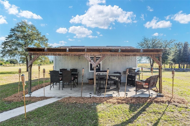 view of patio with area for grilling and a rural view