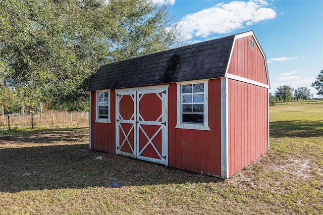 view of outdoor structure with a lawn