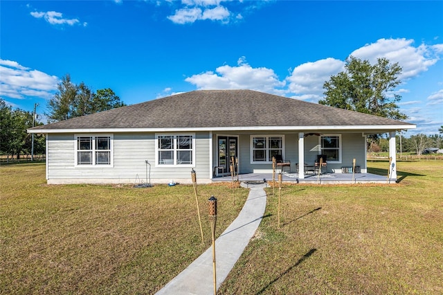 view of front facade with a front lawn and a patio