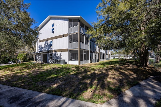 view of side of home featuring central air condition unit