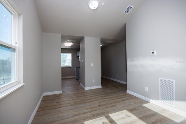 spare room with light wood-type flooring