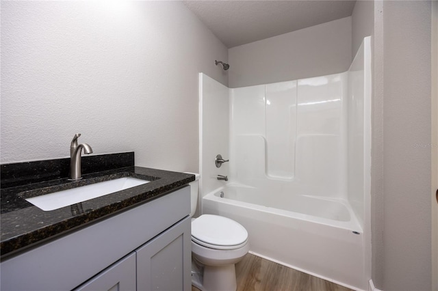 full bathroom featuring wood-type flooring, vanity, toilet, and shower / tub combination