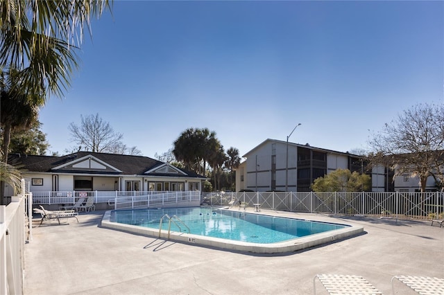 view of swimming pool featuring a patio