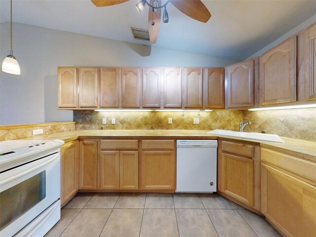 kitchen with decorative light fixtures, white appliances, sink, and light brown cabinetry