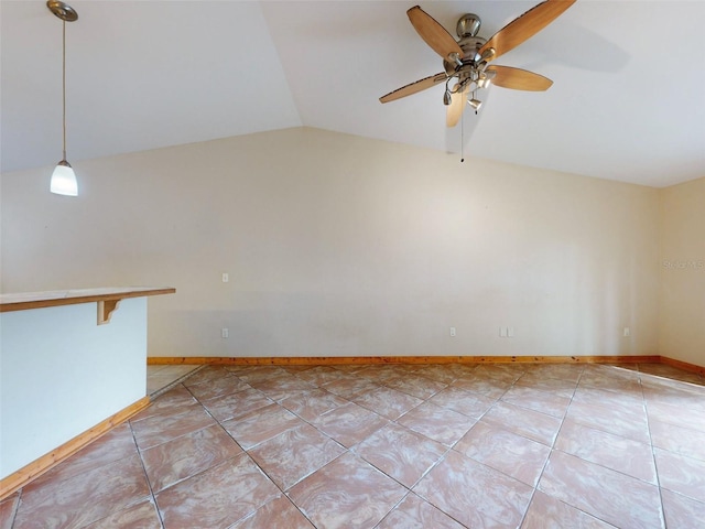 tiled empty room with ceiling fan and lofted ceiling