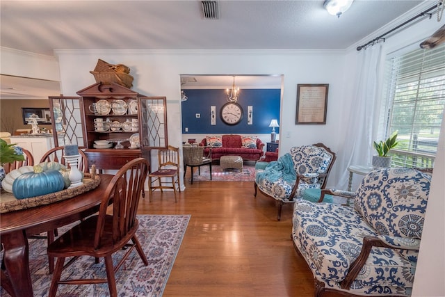 dining room featuring crown molding and dark wood-type flooring