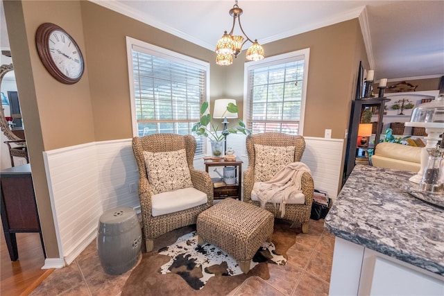 sitting room with light tile patterned floors, an inviting chandelier, and crown molding