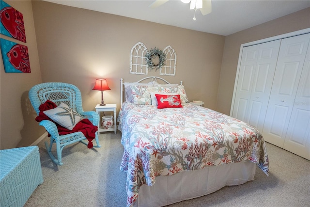 carpeted bedroom with ceiling fan and a closet