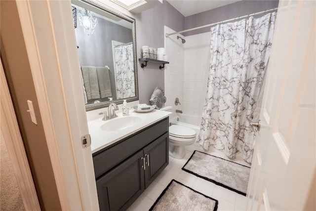 full bathroom with tile patterned flooring, vanity, shower / tub combo, and toilet