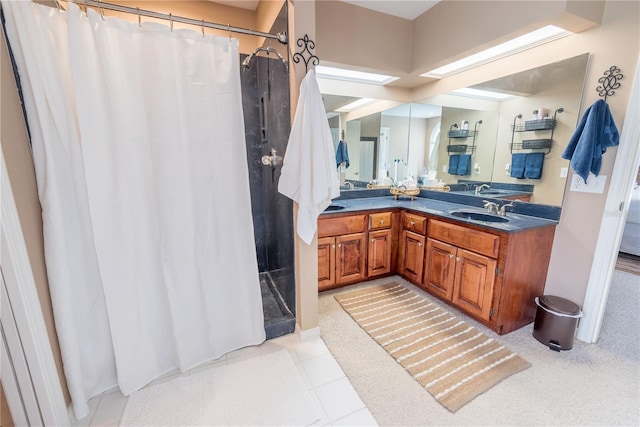 bathroom featuring vanity, tile patterned floors, and walk in shower