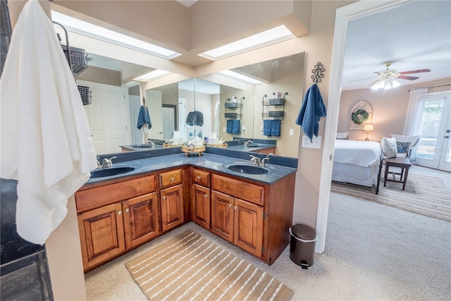 bathroom featuring ceiling fan and vanity