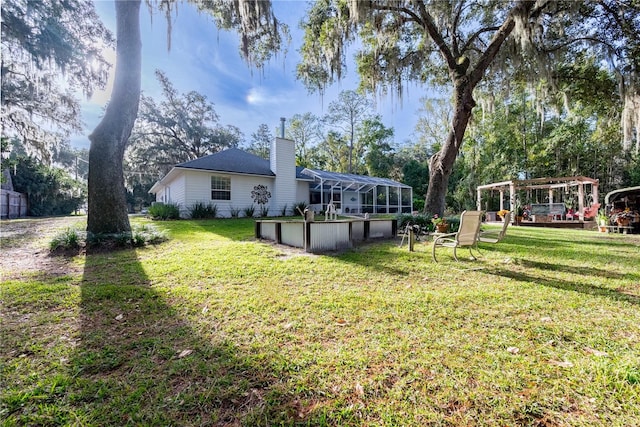 view of yard featuring a lanai and a pool