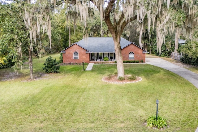 ranch-style house with a front lawn and a porch