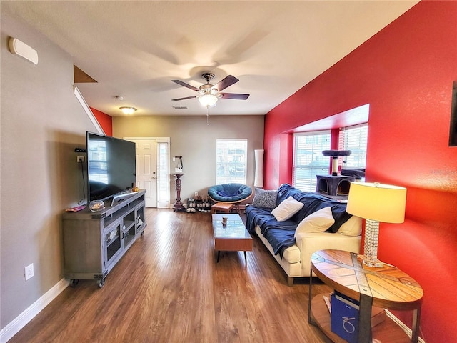 living room with wood-type flooring and ceiling fan