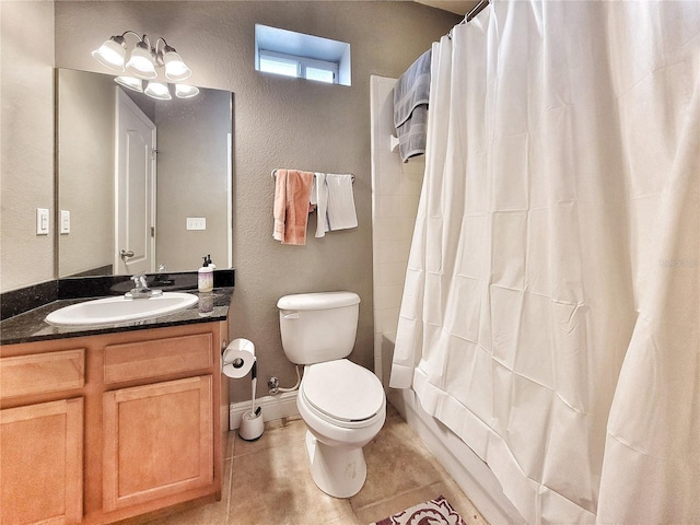 full bathroom with shower / bath combination with curtain, tile patterned floors, vanity, a notable chandelier, and toilet