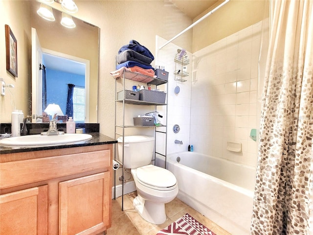 full bathroom with toilet, vanity, tile patterned floors, and shower / bath combo with shower curtain