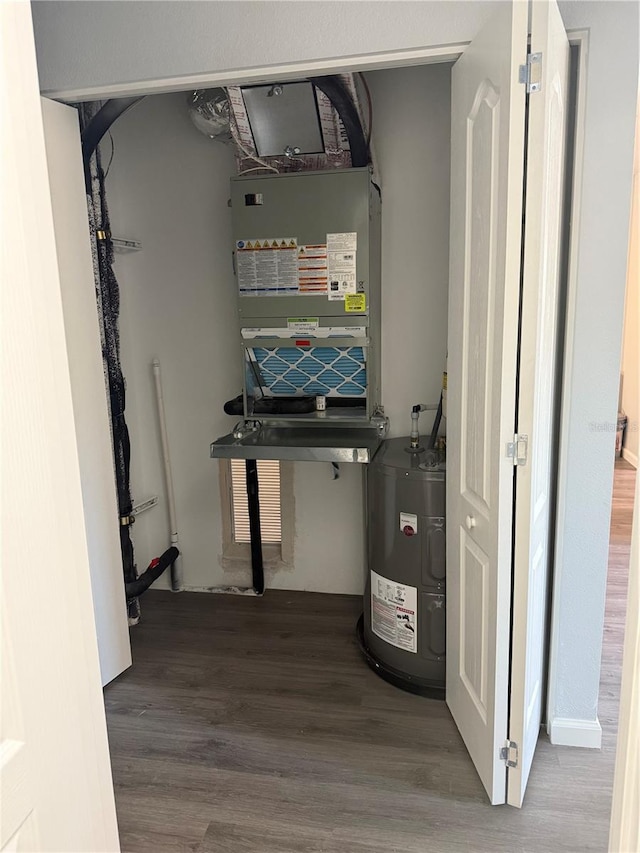 utility room with electric water heater