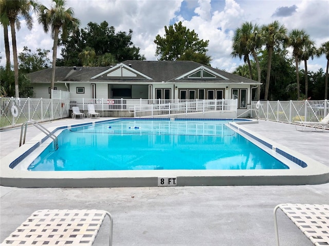 view of swimming pool featuring a patio area