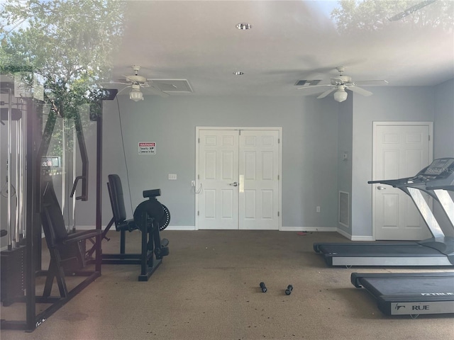 exercise area with ceiling fan and carpet