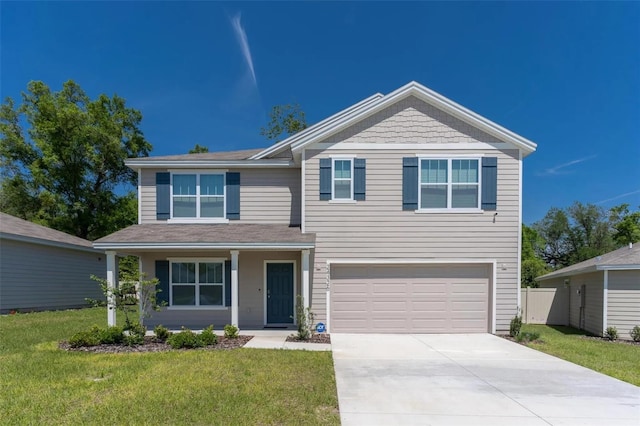 view of front facade featuring a front lawn and a garage