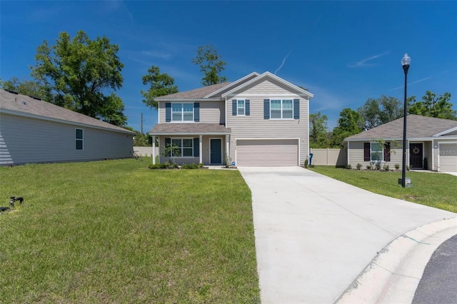 view of front of house with a garage and a front lawn