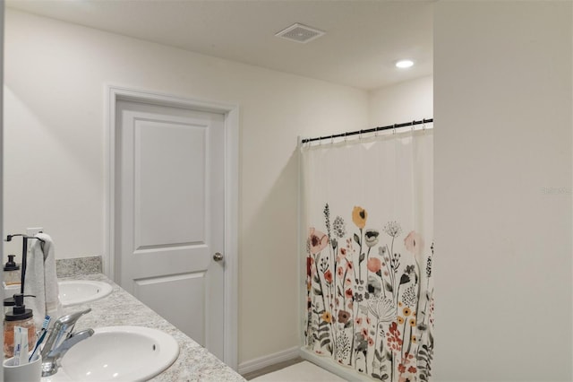 bathroom with a shower with curtain and vanity