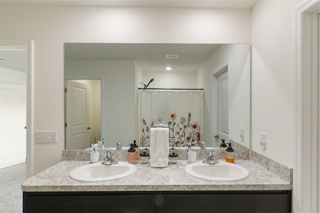 bathroom featuring vanity and a shower with shower curtain