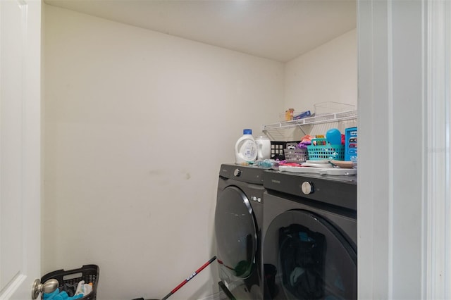 clothes washing area with washer and dryer