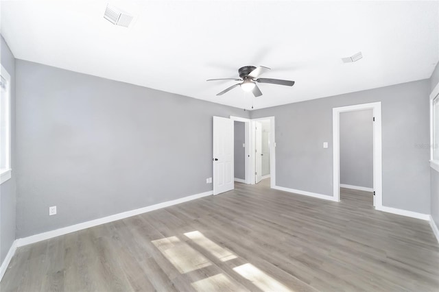 spare room with ceiling fan and light hardwood / wood-style floors