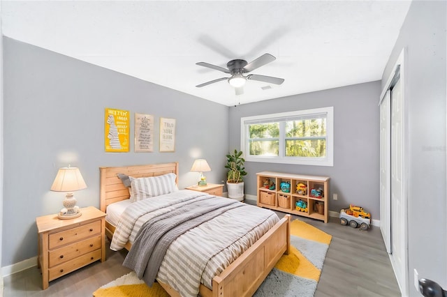 bedroom featuring a closet, ceiling fan, and light hardwood / wood-style flooring