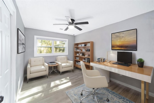 office space featuring ceiling fan and light hardwood / wood-style flooring