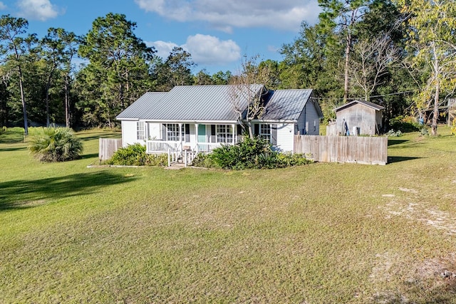 view of front facade with covered porch and a front yard