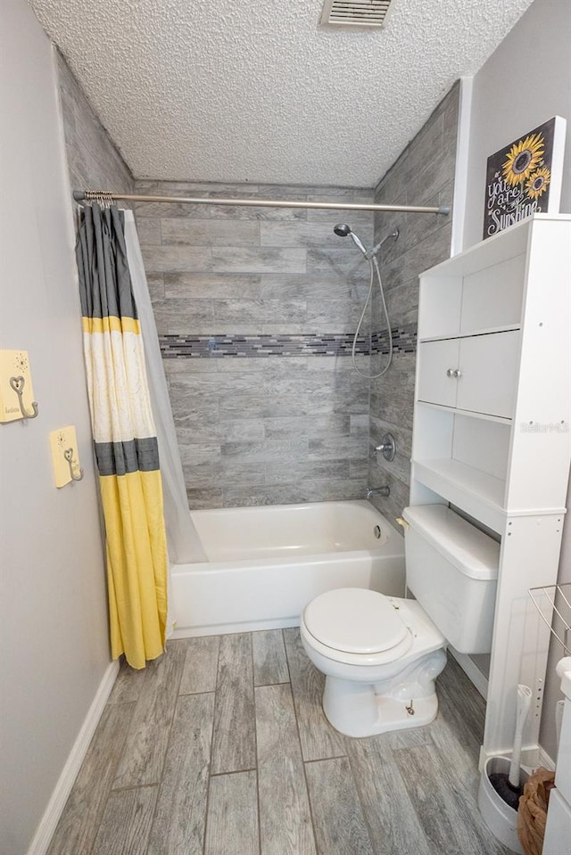 bathroom featuring a textured ceiling, toilet, shower / tub combo, and hardwood / wood-style flooring