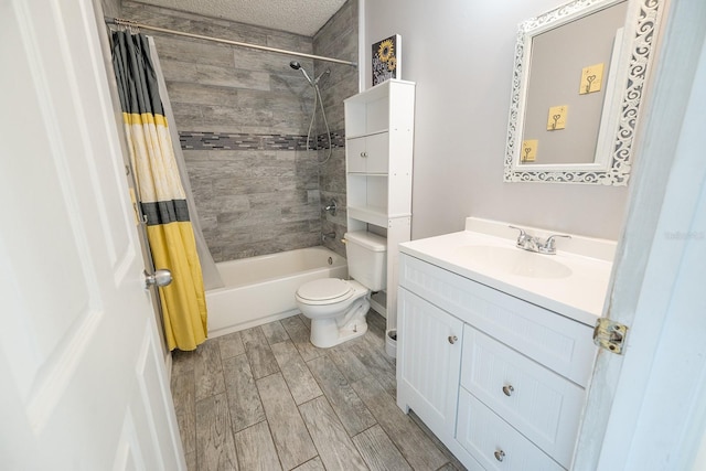 full bathroom with vanity, shower / bath combination with curtain, toilet, a textured ceiling, and wood-type flooring