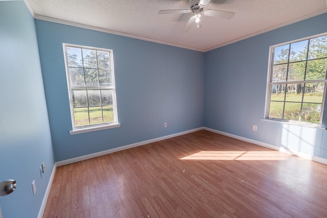 unfurnished room featuring ceiling fan, crown molding, light wood-type flooring, and a textured ceiling