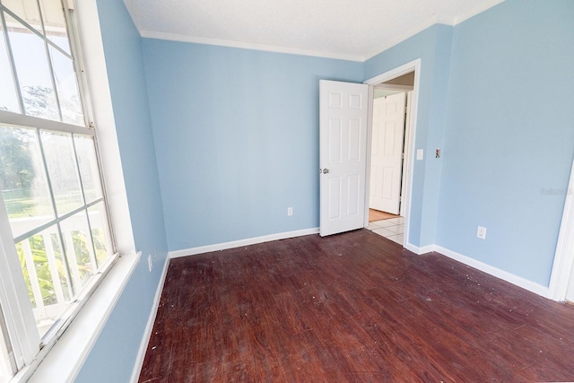 unfurnished room with crown molding and light hardwood / wood-style flooring