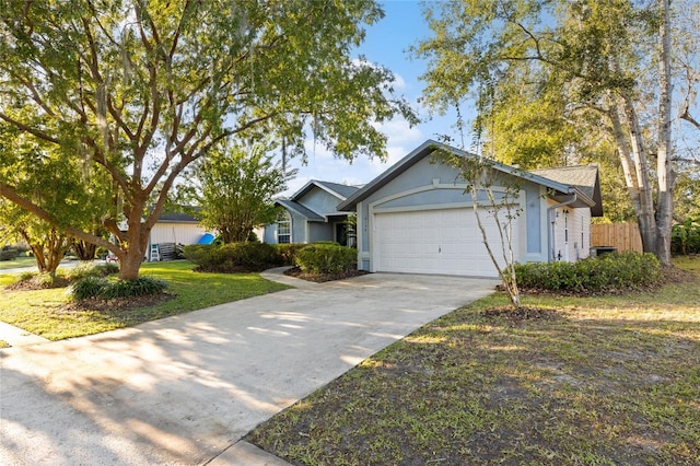 ranch-style home featuring a garage and a front lawn