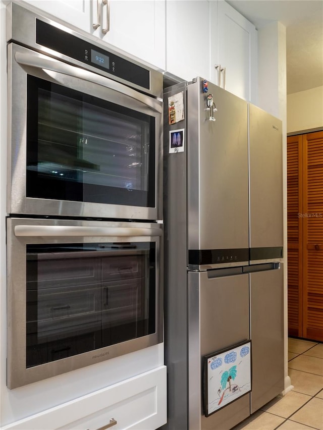 room details featuring white cabinetry and appliances with stainless steel finishes