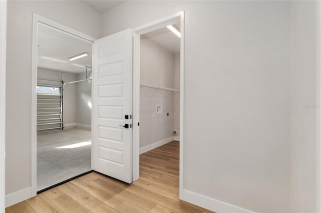 walk in closet with wood-type flooring